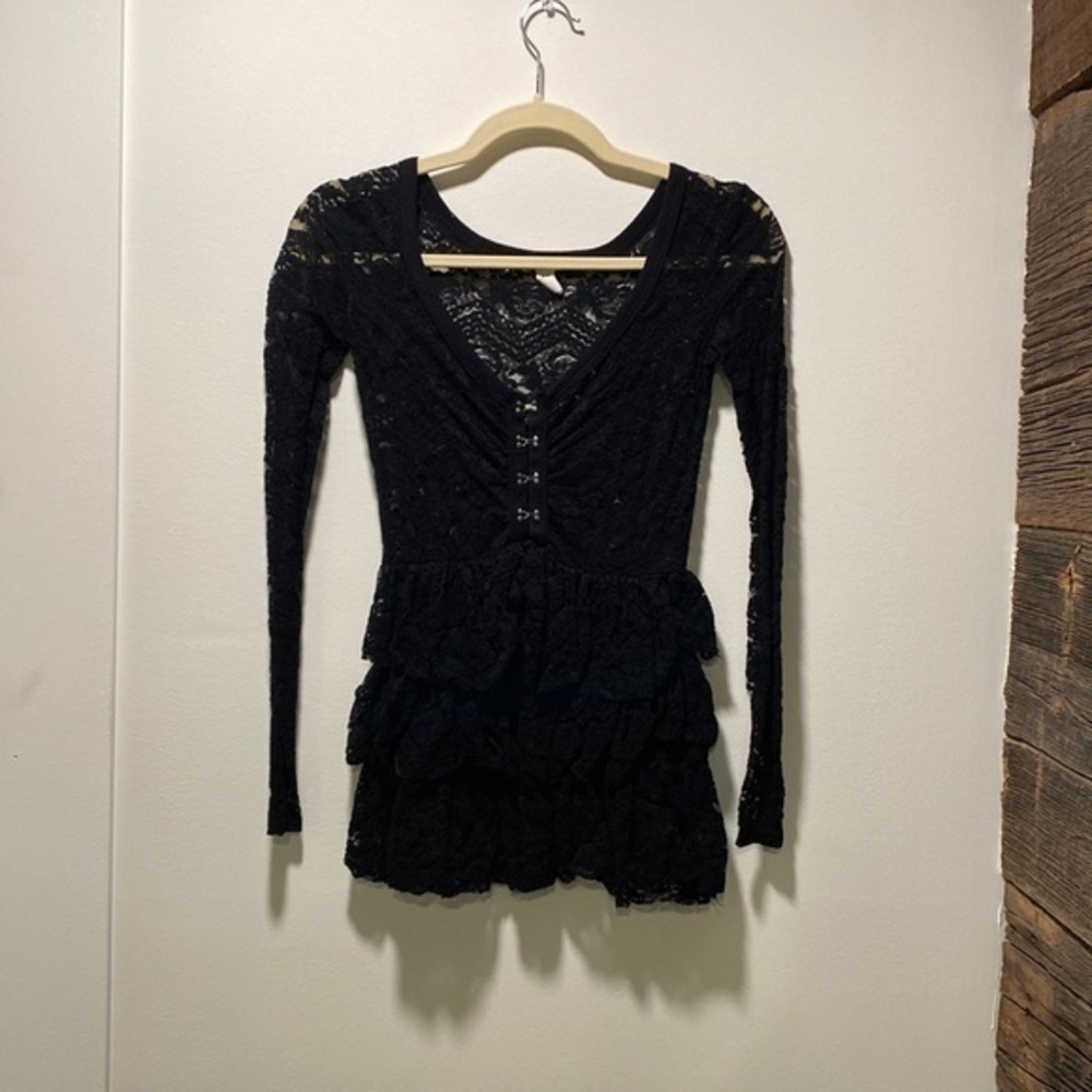 Black lace top with hook eye closure and ruffled bottom, Size XS